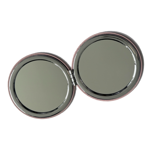 Compact mirror with two round reflective surfaces on a white background