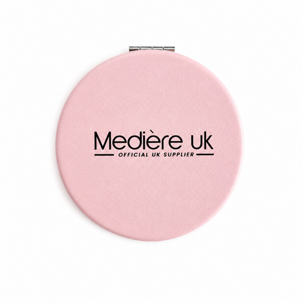 Pink compact mirror with 'Medière UK' branding on a white background
