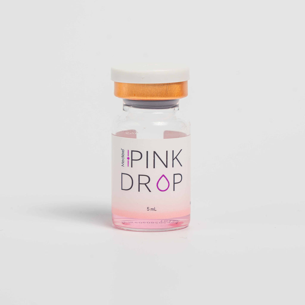 Pink Drop vial on a light gray background