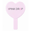Heart-shaped pink mirror with 'Pink Drop' branding on a white background