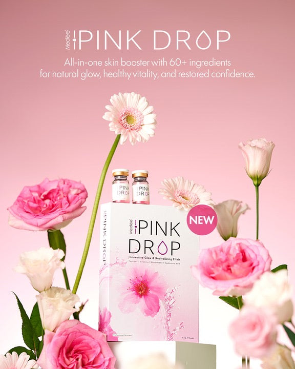 Pink Drop skincare product with flowers on a pink background